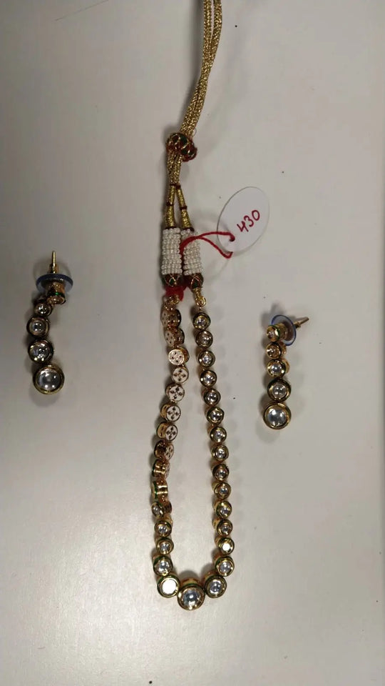 Polki Stone Brass Necklace and Earrings Set