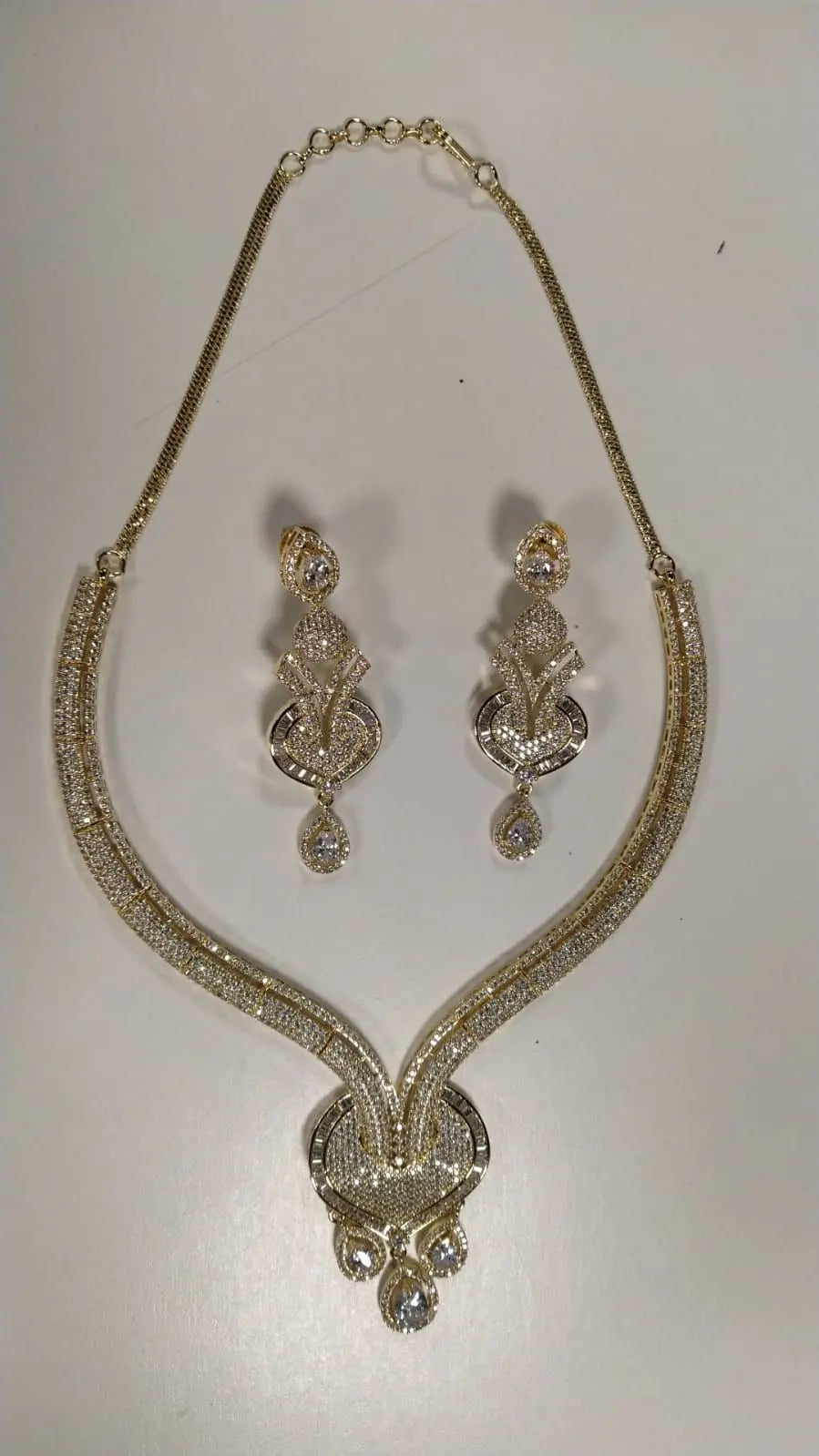Stone Studded Brass Choker and Earring Set in Gold and Silver