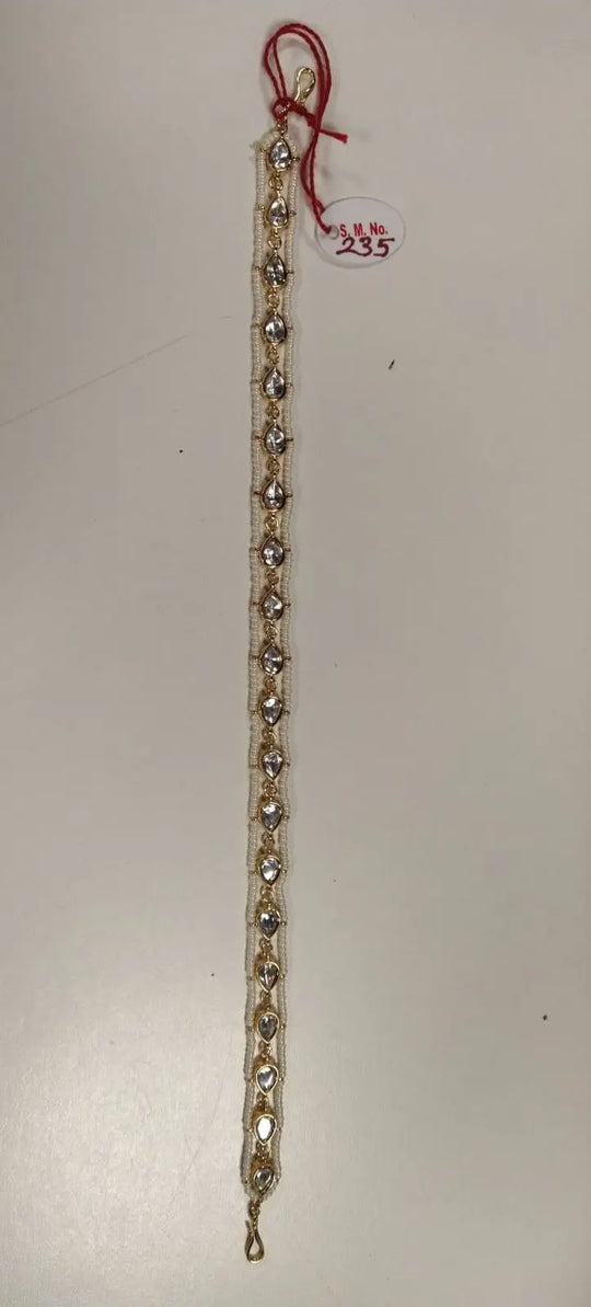 Teardrop Polki and Pearl Border Mathapatti in Brass