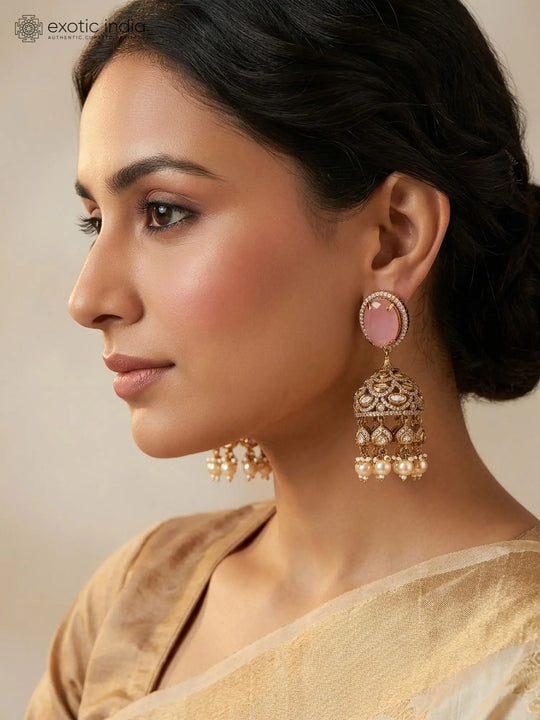 Pink Kundan Jhumka Earrings with Pearl Drops in Brass