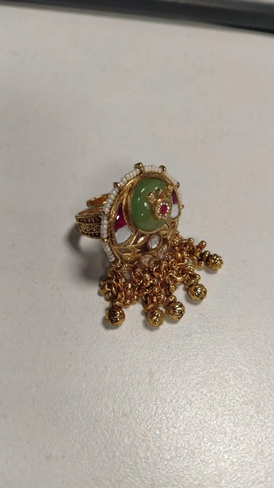 Kundan Brass Ring with Green and Pink Enamel Accents