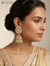 Floral Kundan Jhumka Earrings with Bead Drops in Brass