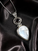 Faceted Rainbow Moonstone and Garnet Sterling Silver Pendant
