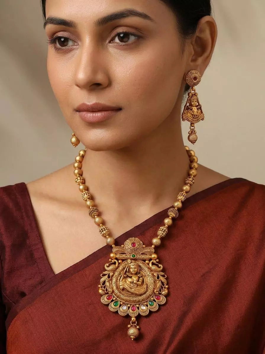 Bal Krishna and Cow Stone Studded Brass Necklace and Earrings Set