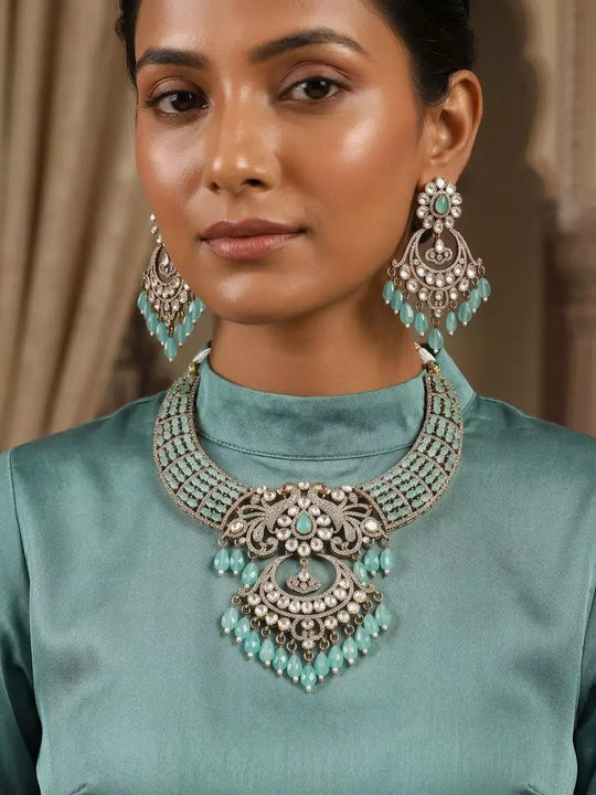 Brass and Alloy Stone Studded Necklace and Earrings Set