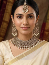Ivory and Gold Stone Studded Brass Necklace Set with Earrings and Maang Tikka