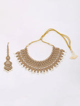 Ivory and Gold Stone Studded Brass Necklace Set with Earrings and Maang Tikka