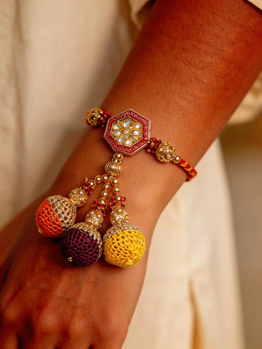 Kundan Studded Metal and Thread Rakhi Bracelet with Latkan